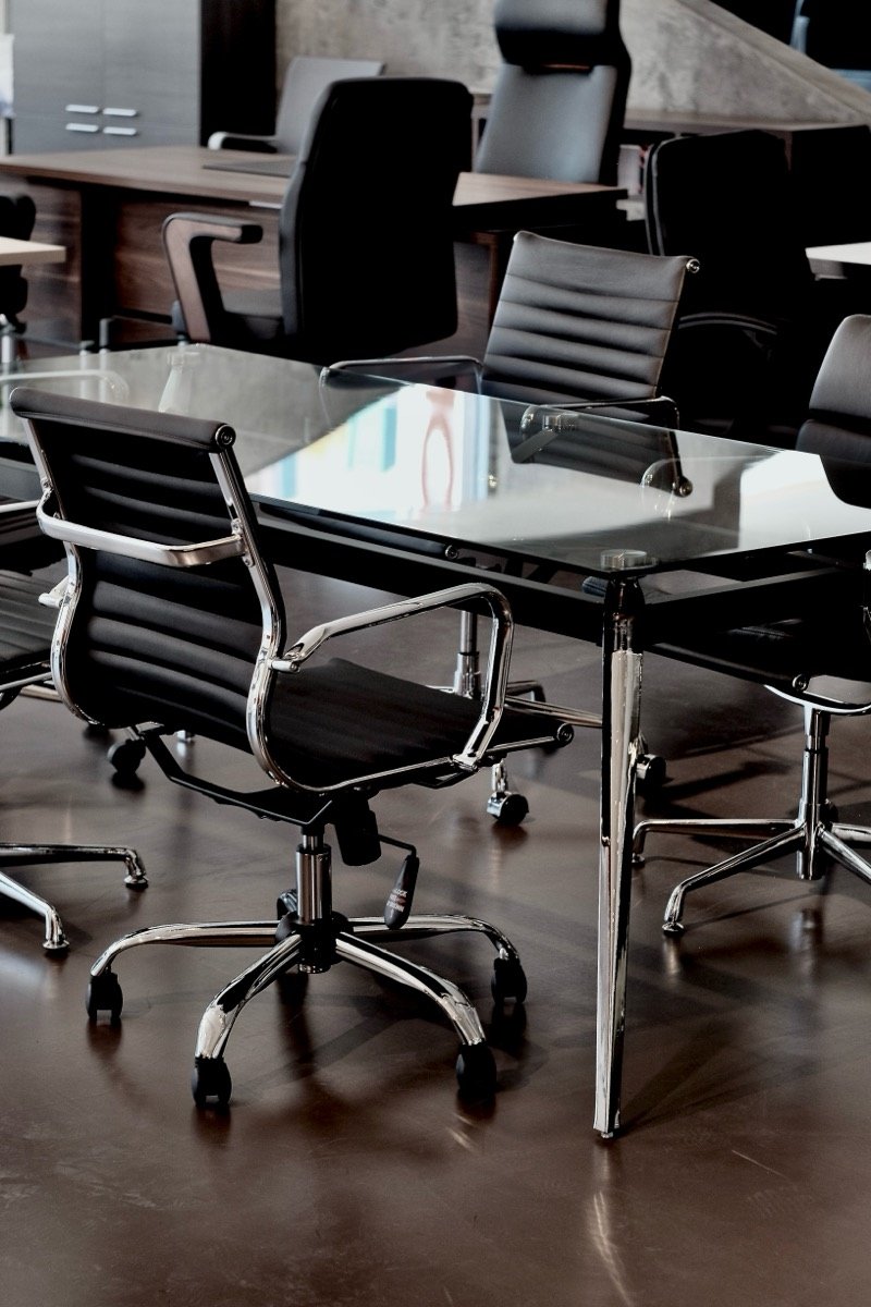 Office chairs around a meeting table, photographed for NORA Furnishings in Cyprus