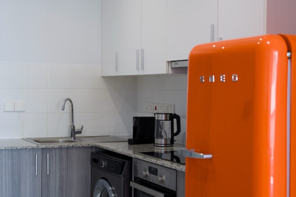 Airbnb apartment photography Nicosia Orange Smeg fridge and kitchen